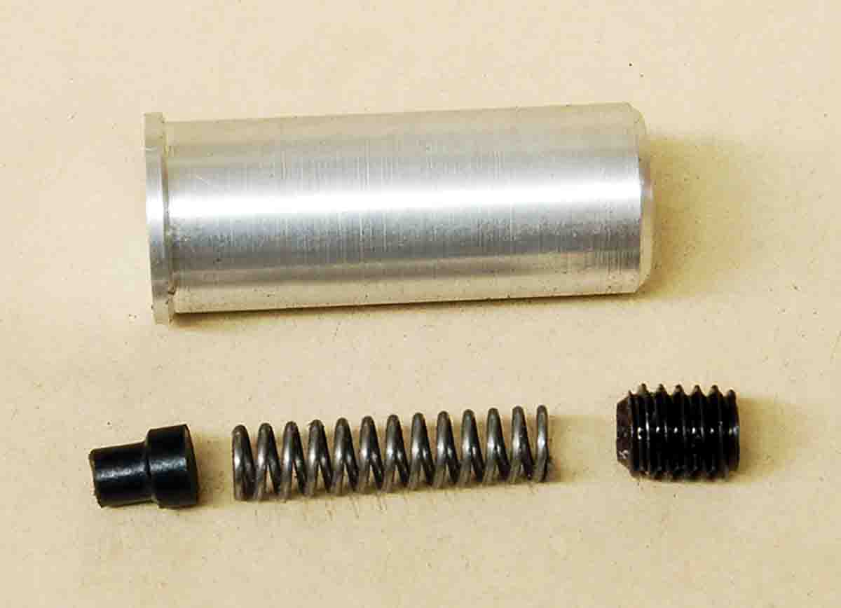 Aluminum snap cap body and components: acetal “primer” insert, spring and setscrew to adjust spring tension.